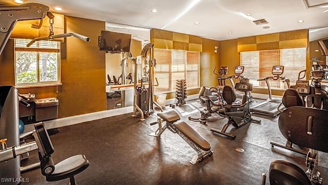 gym featuring baseboards, recessed lighting, and visible vents