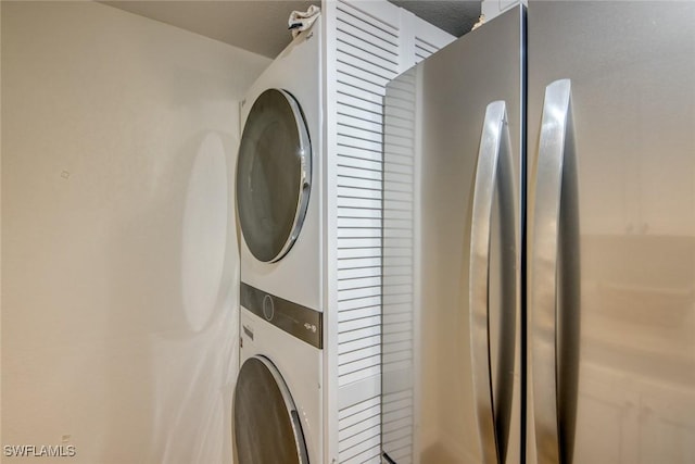 laundry room with laundry area and stacked washer / drying machine