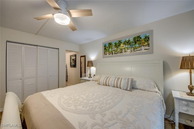 bedroom featuring a closet, baseboards, and ceiling fan
