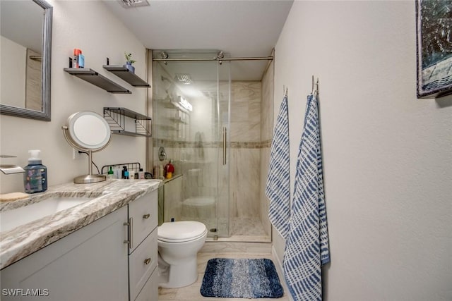 full bath featuring toilet, a stall shower, marble finish floor, and vanity