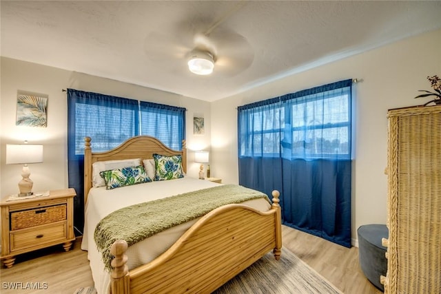 bedroom featuring ceiling fan and light wood-style floors