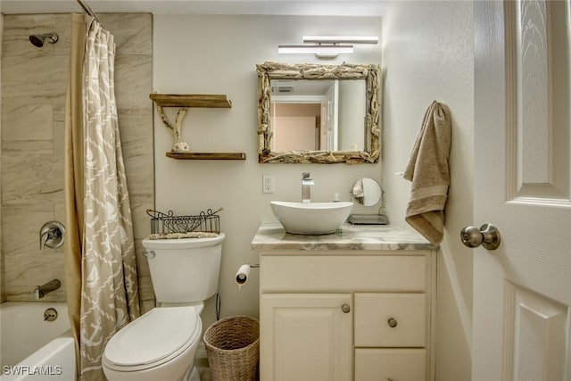 bathroom featuring toilet, shower / bath combo with shower curtain, and vanity