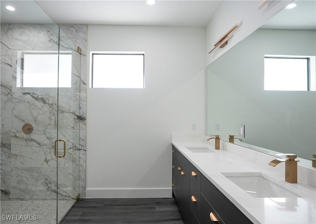 3384 Canal St, Naples, FL 34112 - bathroom with recessed lighting, a marble finish shower, baseboards, and a sink