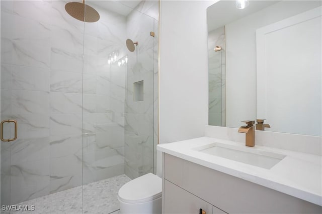 3384 Canal St, Naples, FL 34112 - full bathroom featuring a marble finish shower, vanity, and toilet