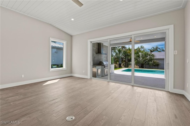 1134 Trail Terrace Dr, Naples, FL 34103 - spare room featuring vaulted ceiling, wooden ceiling, wood finished floors, baseboards, and ceiling fan
