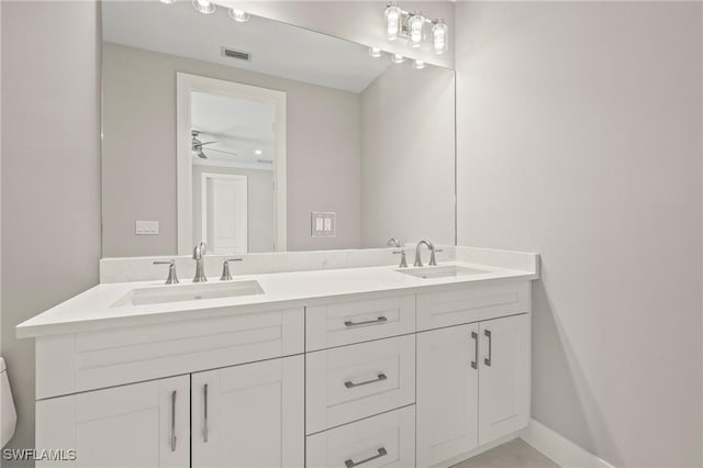 1134 Trail Terrace Dr, Naples, FL 34103 - full bath featuring double vanity, visible vents, toilet, and a sink