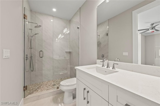 1134 Trail Terrace Dr, Naples, FL 34103 - bathroom featuring ceiling fan, toilet, a stall shower, and vanity