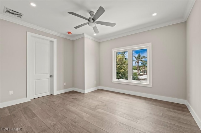 1134 Trail Terrace Dr, Naples, FL 34103 - empty room featuring crown molding, a ceiling fan, wood finished floors, baseboards, and visible vents