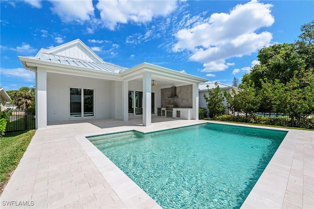 1134 Trail Terrace Dr, Naples, FL 34103 - rear view of property with fence, a fenced in pool, ceiling fan, a standing seam roof, and a patio area