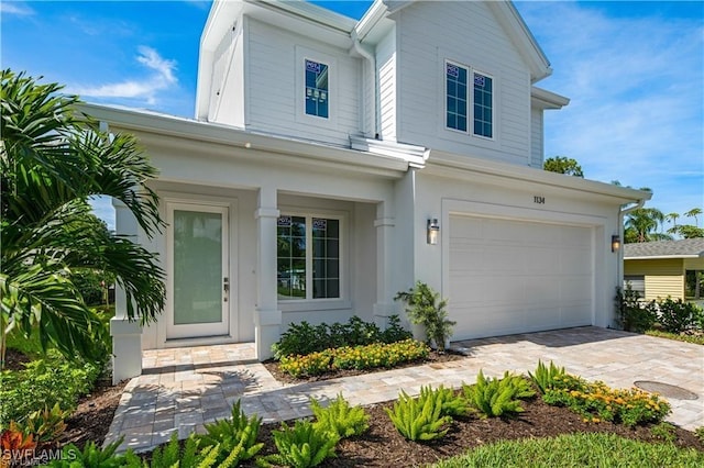 1134 Trail Terrace Dr, Naples, FL 34103 - view of front of house featuring driveway and a garage