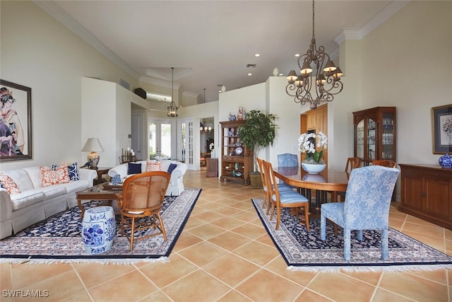 living area with crown molding, a notable chandelier, light tile patterned flooring, and a towering ceiling