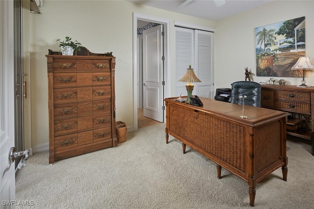 office space featuring ceiling fan, baseboards, and carpet floors