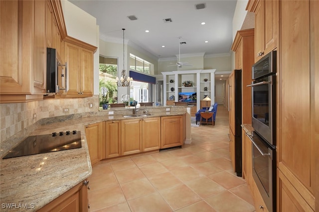 kitchen with ceiling fan with notable chandelier, a peninsula, a sink, open floor plan, and black electric cooktop