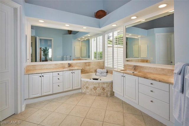 bathroom featuring recessed lighting, tile patterned flooring, vanity, and a garden tub