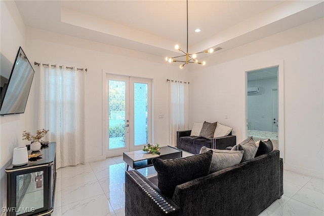 233 39th Ave NE, Naples, FL 34120 - living room with light marble finish flooring, a chandelier, french doors, baseboards, and a raised ceiling