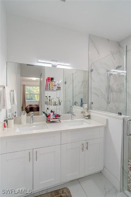 233 39th Ave NE, Naples, FL 34120 - full bath featuring connected bathroom, a marble finish shower, double vanity, and marble look tiles