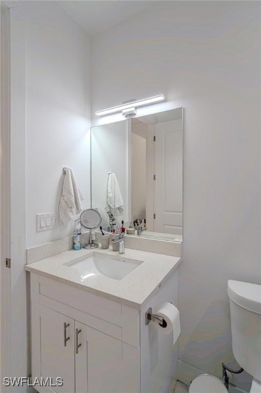 233 39th Ave NE, Naples, FL 34120 - half bath featuring toilet and vanity
