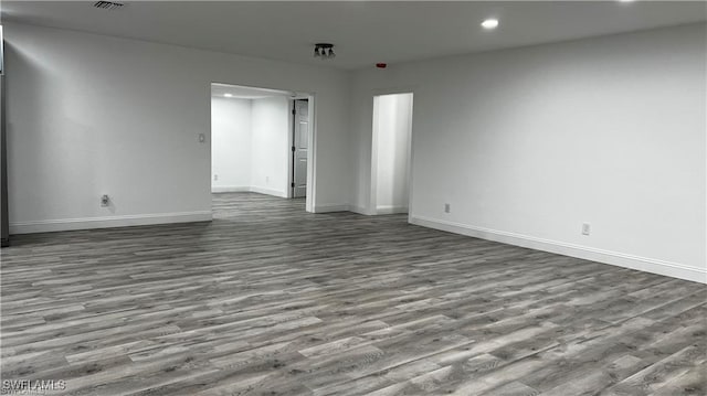 310 S Elm St, Labelle, FL 33935 - unfurnished room featuring baseboards, wood finished floors, and recessed lighting