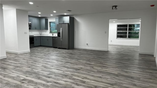 310 S Elm St, Labelle, FL 33935 - kitchen with light countertops, open floor plan, stainless steel appliances, visible vents, and recessed lighting