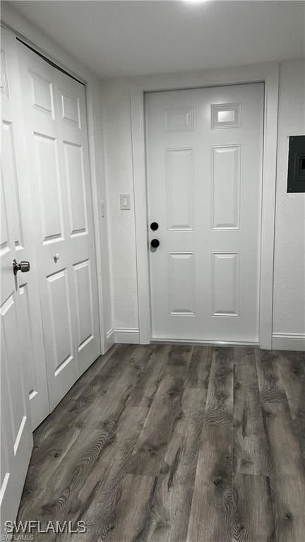 310 S Elm St, Labelle, FL 33935 - doorway featuring dark wood-style flooring and baseboards