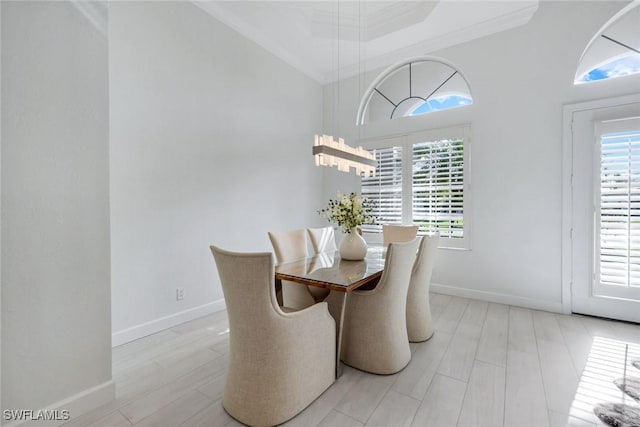 16017 Delarosa Ln, Naples, FL 34110 - dining room featuring baseboards, a healthy amount of sunlight, and crown molding