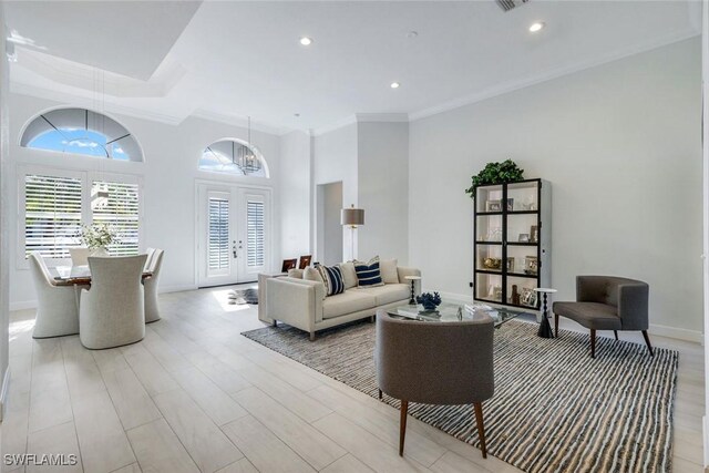 16017 Delarosa Ln, Naples, FL 34110 - living room featuring recessed lighting, baseboards, ornamental molding, and light wood-style flooring