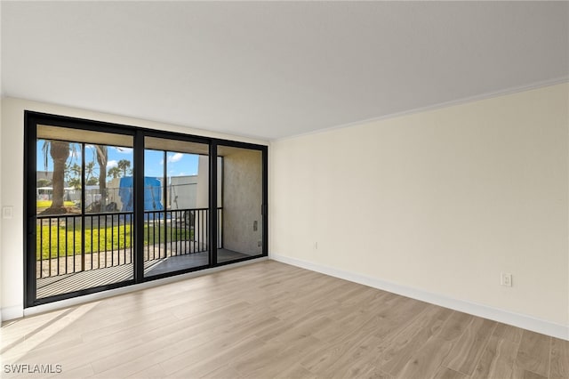 1501 Middle Gulf Dr Unit I-101, Sanibel, FL 33957 - unfurnished room featuring light wood-style flooring and baseboards