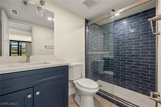 1501 Middle Gulf Dr Unit I-101, Sanibel, FL 33957 - bathroom with toilet, vanity, a shower stall, and visible vents