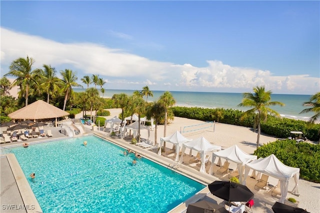 1501 Middle Gulf Dr Unit I-101, Sanibel, FL 33957 - pool featuring a water view and a patio
