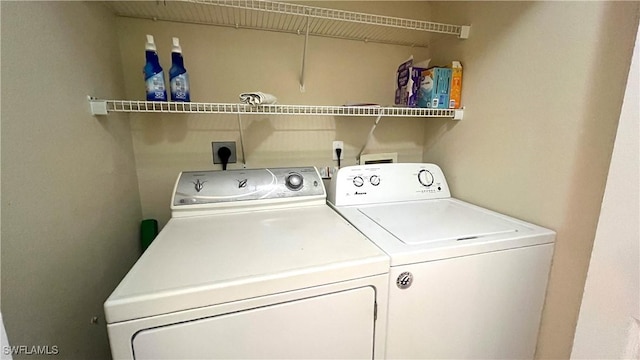 7725 Woodbrook Cir Unit 3503, Naples, FL 34104 - clothes washing area with independent washer and dryer