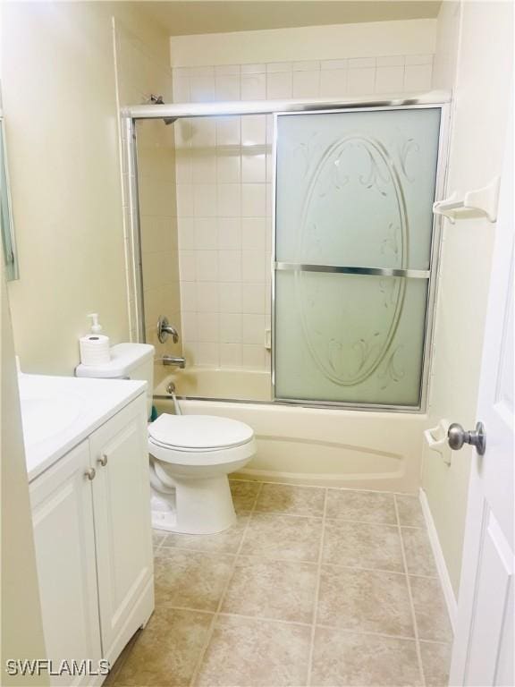 7725 Woodbrook Cir Unit 3503, Naples, FL 34104 - bathroom featuring combined bath / shower with glass door, vanity, and toilet