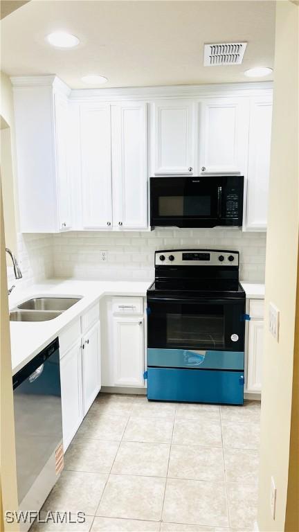 7725 Woodbrook Cir Unit 3503, Naples, FL 34104 - kitchen featuring black appliances, white cabinetry, light countertops, tasteful backsplash, and recessed lighting