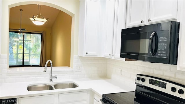 7725 Woodbrook Cir Unit 3503, Naples, FL 34104 - kitchen featuring black microwave, electric range, a sink, and white cabinets