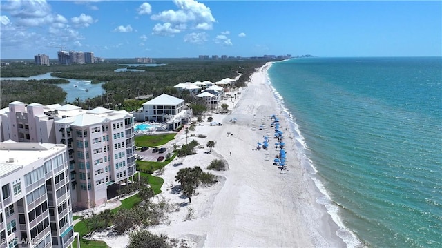 birds eye view of property with a view of the beach and a water view
