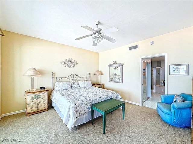 bedroom featuring visible vents, baseboards, ceiling fan, connected bathroom, and light colored carpet