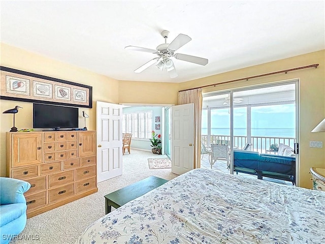 carpeted bedroom featuring a ceiling fan and access to outside