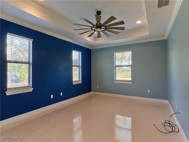 4324 22nd Ave SE, Naples, FL 34117 - empty room featuring plenty of natural light, a raised ceiling, ceiling fan, and visible vents