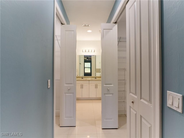 4324 22nd Ave SE, Naples, FL 34117 - hallway with light tile patterned floors
