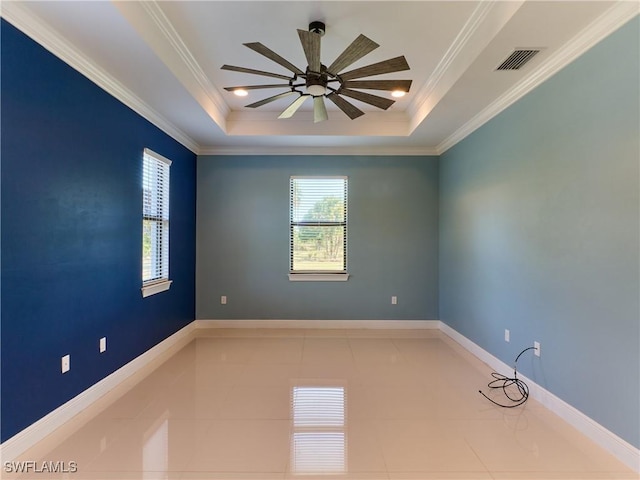 4324 22nd Ave SE, Naples, FL 34117 - tiled spare room with crown molding, a ceiling fan, a tray ceiling, and visible vents