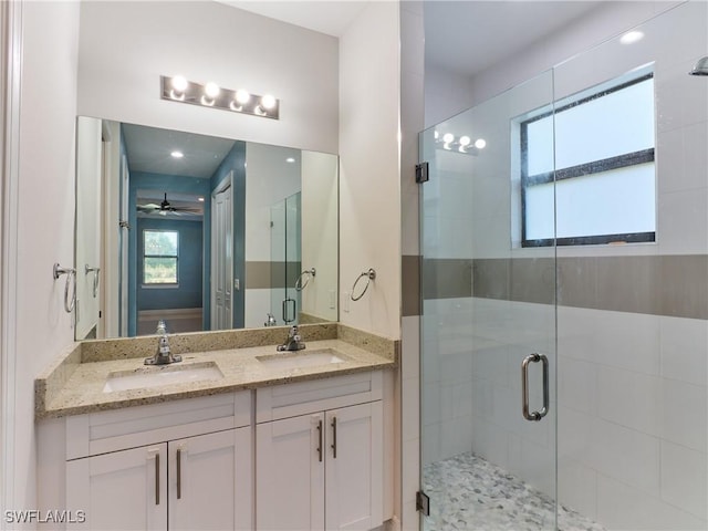 4324 22nd Ave SE, Naples, FL 34117 - full bathroom featuring a wealth of natural light, a sink, and a stall shower