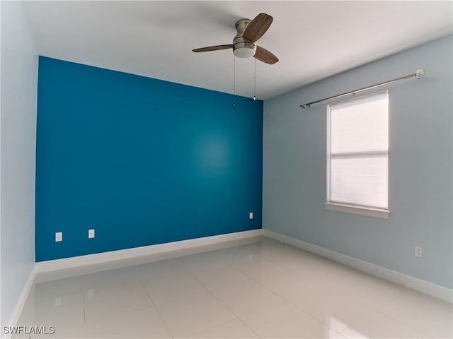 4324 22nd Ave SE, Naples, FL 34117 - tiled spare room with a ceiling fan and baseboards