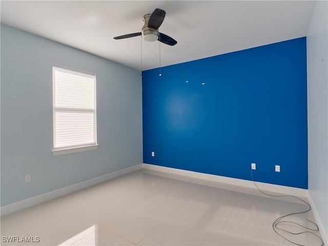 4324 22nd Ave SE, Naples, FL 34117 - tiled spare room with baseboards and a ceiling fan