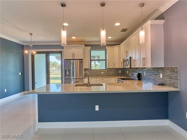 4324 22nd Ave SE, Naples, FL 34117 - kitchen featuring visible vents, a peninsula, light stone countertops, a sink, and stainless steel appliances