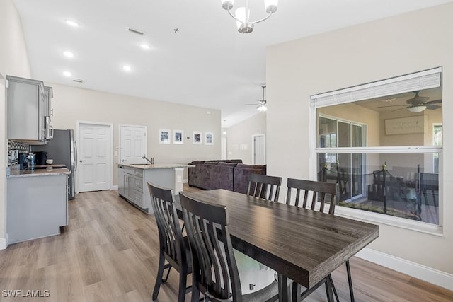 dining space with baseboards, light wood-type flooring, recessed lighting, and a ceiling fan