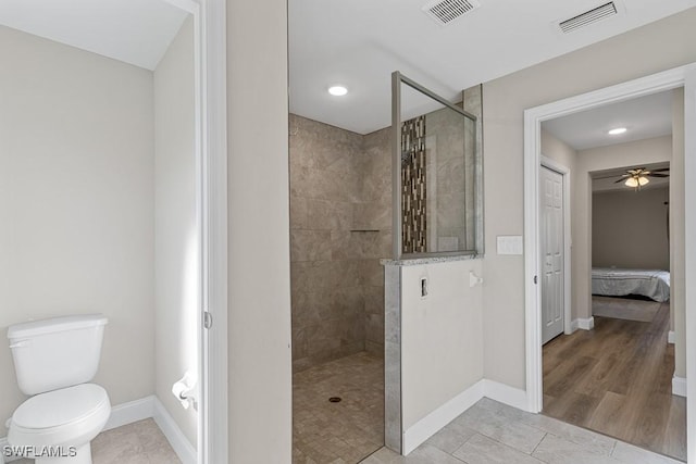 full bath with baseboards, visible vents, and walk in shower