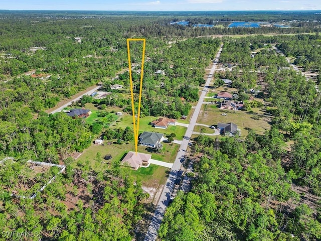 aerial view featuring a wooded view