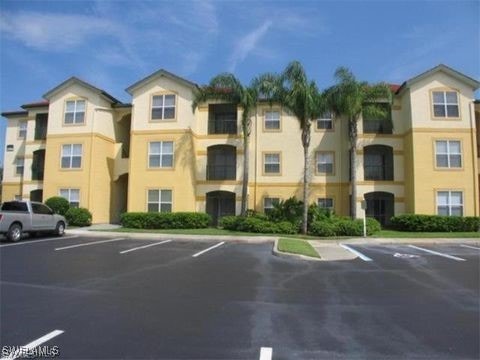 11510 Villa Grand Unit 418, Fort Myers, FL 33913 - view of property with uncovered parking