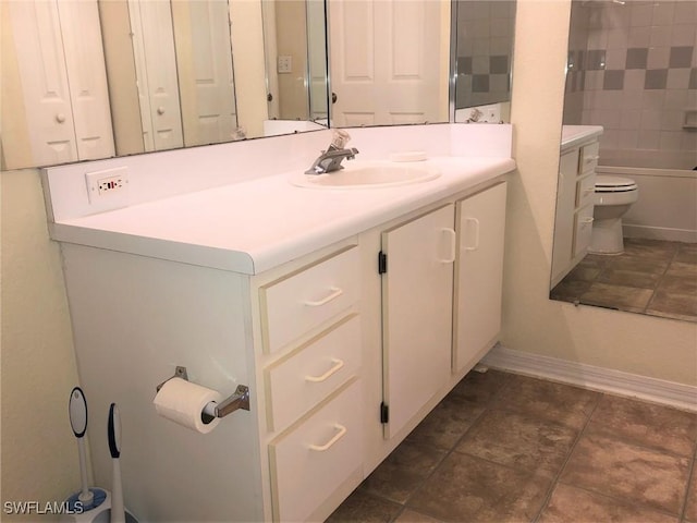 11510 Villa Grand Unit 418, Fort Myers, FL 33913 - bathroom with baseboards, bathtub / shower combination, toilet, tile patterned floors, and vanity