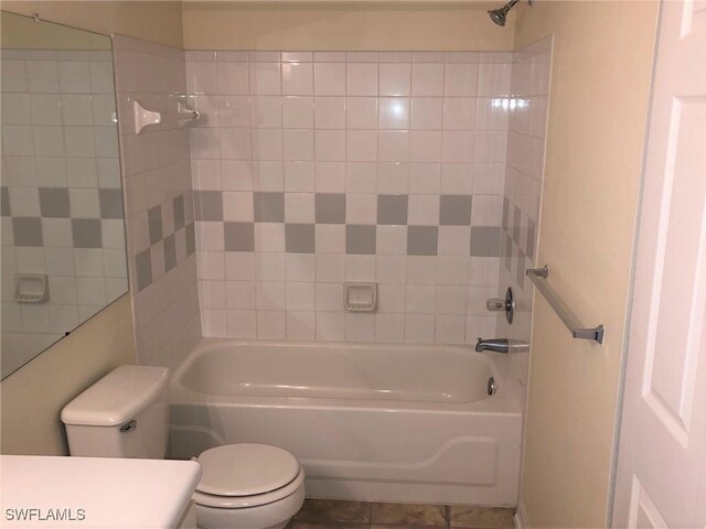 11510 Villa Grand Unit 418, Fort Myers, FL 33913 - full bathroom with  shower combination, toilet, tile patterned flooring, and vanity
