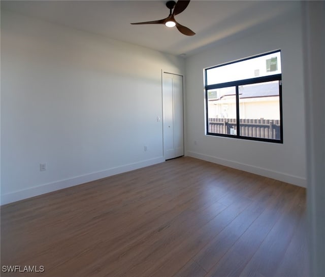 1817 NE 17th St, Cape Coral, FL 33909 - unfurnished room with baseboards, a ceiling fan, and wood finished floors